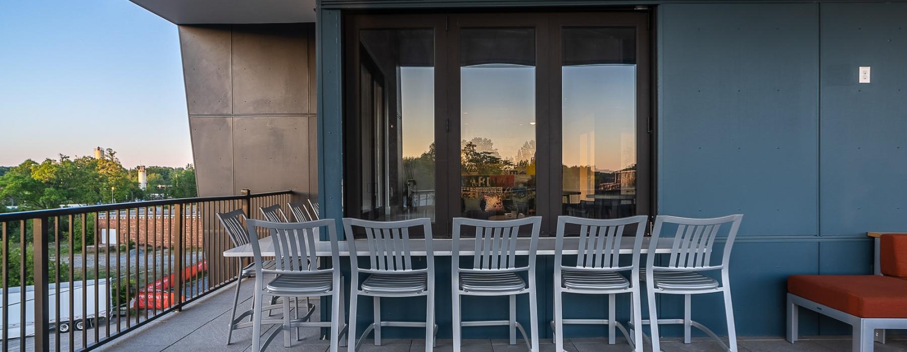 a table and chairs outside a building