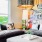 a living room with a couch and a lamp