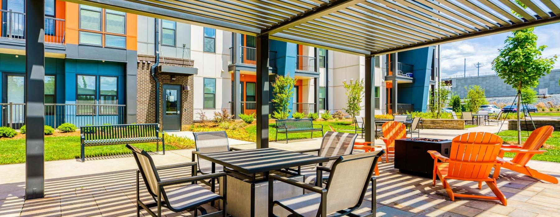 a patio with tables and chairs