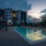 a swimming pool in front of a building